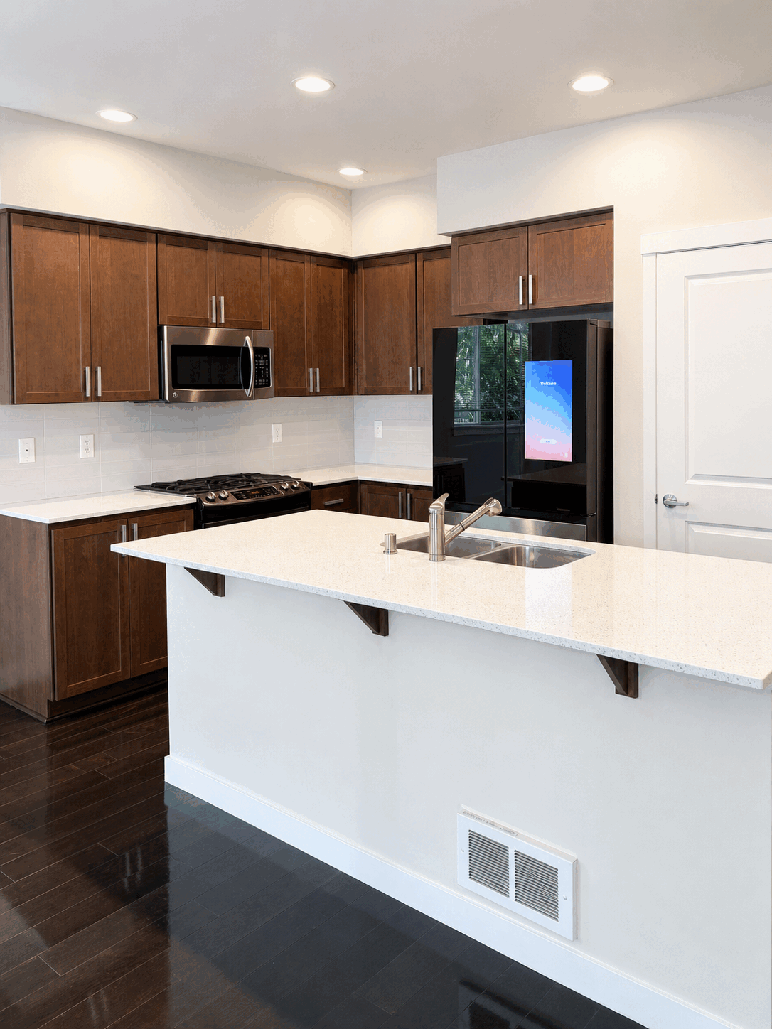 Bright client kitchen with polished island and floors